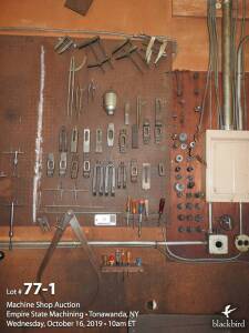 Miscellaneous hold downs and calipers on peg board