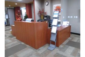Approx. 6' Receptionist Desk with 5' Storage Shelving and 3' Storage Cabinet. HIT# 2233025. Loc: Lobby. Asset Located at 8888 Balboa Avenue, San D...