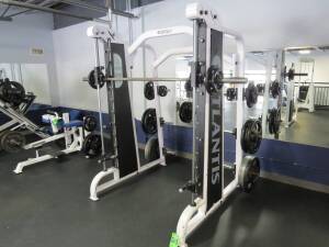 Weight Machine w/ free weights Smith Atlantis, Mod. E-154, w/ (6) 45lb Hampton, (4) 45lb YRC, (2) 25lb YRC, (2) 10lb YRC, (4) 2.5lb YRC