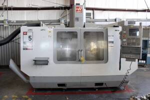 CNC VERTICAL MACHINING CENTER, HAAS MDL. VF5B/40 4-AXIS, new 3/2006, 52" x 23" table, 4,000 lb. table load, 50" X-axis travel, 26" Y-axis travel, 25" Z-axis travel, CAT-40, 10,000 RPM, 20 HP, 20 ATC, TSC, Haas HRT-310 rotary table, No. 40 taper, S/N 47846