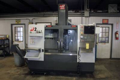 CNC VERTICAL MACHINING CENTER, HAAS MDL. VF-2, new 2013, Haas Classic CNC control, 36" x 14" table, 30" X-axis travel, 16" Y-axis travel, 20" Z-axis travel, Renishaw probing system, Haas tool probe, 20 pos. umbrella ATC, CAT-40, 427 hrs. cycle start time,
