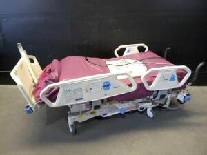 HILL-ROM P1900 TOTALCARE SPORT HOSPITAL BED WITH FOOTBOARD AND 2 MODULES (PERC. & VIB., ROTATION)