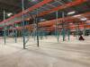GLOBAL OFFER- 305 sections of Industrial Pallet Racking (48"W) - ALREADY DISMANTLED - photos show assets as they were prior to being dismantled and stacked as well as current positions in the warehouse (stacked and or leaned). To win this lot, the winning - 7