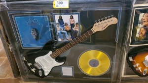 EAGLES MEMORABILIA FRAME WITH ELECTRIC GUITAR AND "THEIR GREATEST HITS" GOLD RECORD (SIGNATURES NOT AUTHENTICATED ) (43X35)