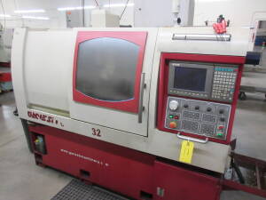 Ganesh Model Cyclone-32CS, CNC Swiss Type Twin Spindle Automatic Screw Machine, S/N CB95016 (New 2006), 1" Max. Bar Dia., 7.5-HP Spindle Drive, 6,000-RPM Max. Spindle Speed, 13" X-Axis, 10.63" Z-Axis, Fanuc Model 10H CNC Control, Chip Blaster, High Pressu