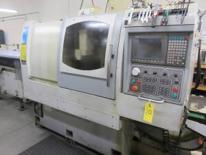 Ganesh Model Cyclone-32CS, CNC Swiss Type Twin Spindle Automatic Screw Machine, S/N CB981002 (New 2009), 1" Max. Bar Dia., 7.5-HP Spindle Drive, 6,000-RPM Max. Spindle Speed, 13" X-Axis, 10.63" Z-Axis, Fanuc Model 10H CNC Control, Chip Blaster, High Press