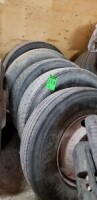 Lot of assorted tires with rims