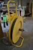 Metal strapping machine with tools on wheeled base - 3
